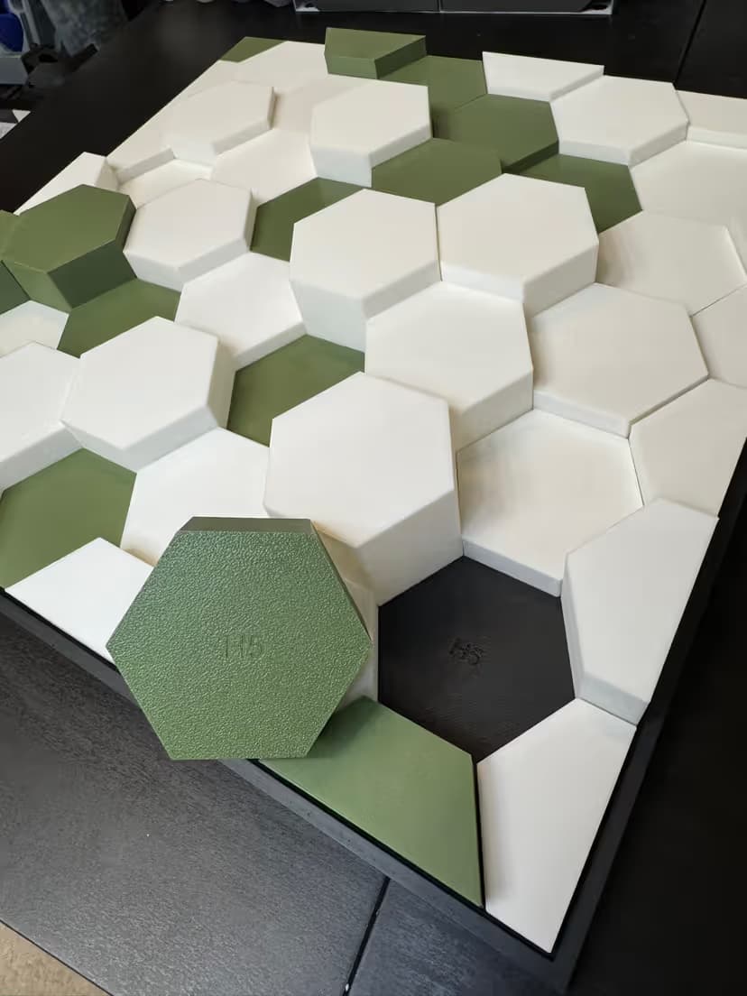 A cover image for a Hexagon Magnetic Wall Art, which is a geometric design featuring hexagonal magnetic wall art in a pattern of white and blue hexagons, showcasing a modern and creative aesthetic. The text highlights the introduction of this original design by TCoops Create.