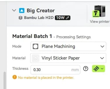 Settings interface displaying options for a printing machine, including mode, material type, and thickness, with a notification indicating no material is placed in the printer.