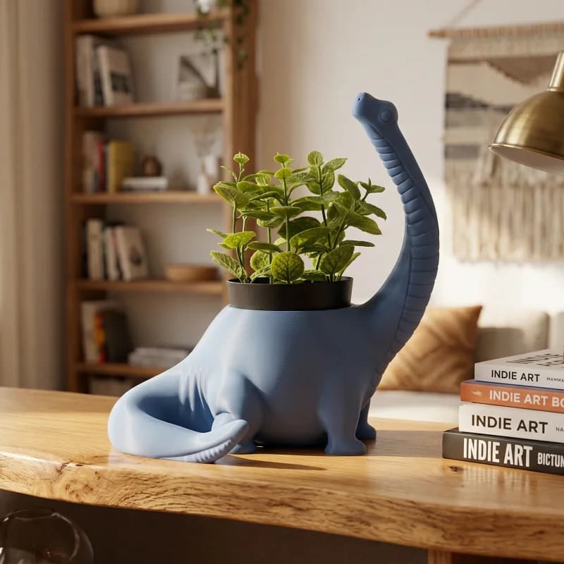 A blue dinosaur-shaped planter holds vibrant green plants, sitting on a wooden table in a cozy living space. In the background, a bookshelf filled with books and a stylish lamp add to the inviting atmosphere.
